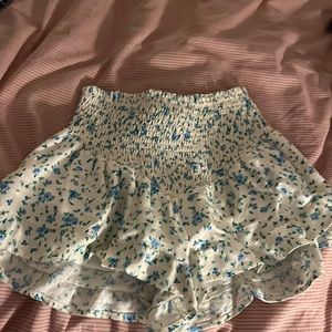 White skirt with blue and green flowers from Bershka